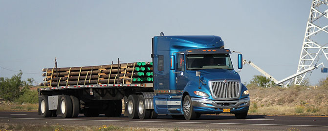 18 Wheeler hauling Drill Pipe